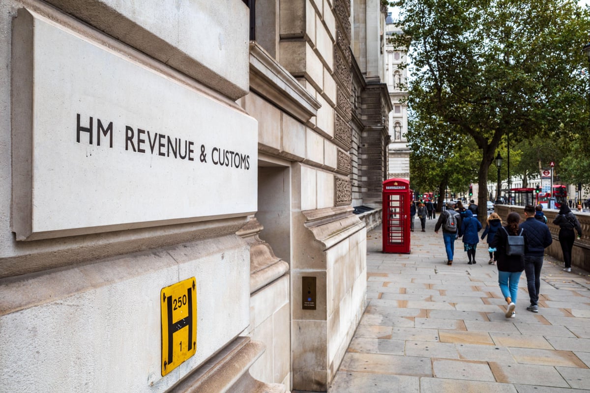 People walk past HMRC’s offices in Whitehall, London