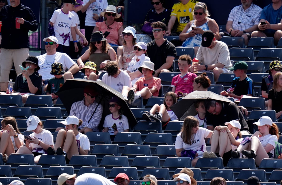 Spectators under umbrellas in the crowd during the Women’s T20 World Cup match at Bristol