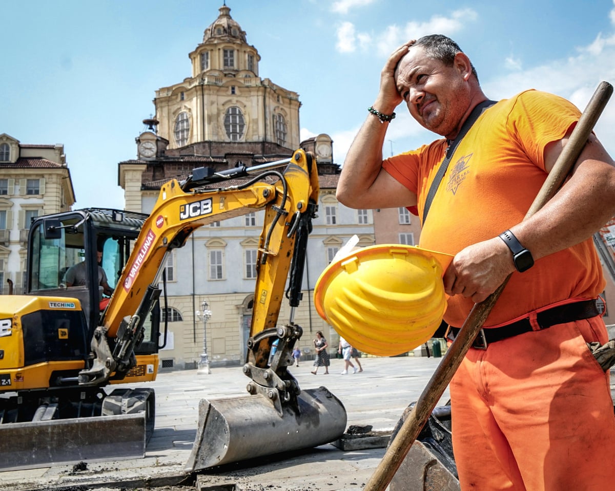 A construction worker feels the heat in Turin, Italy.