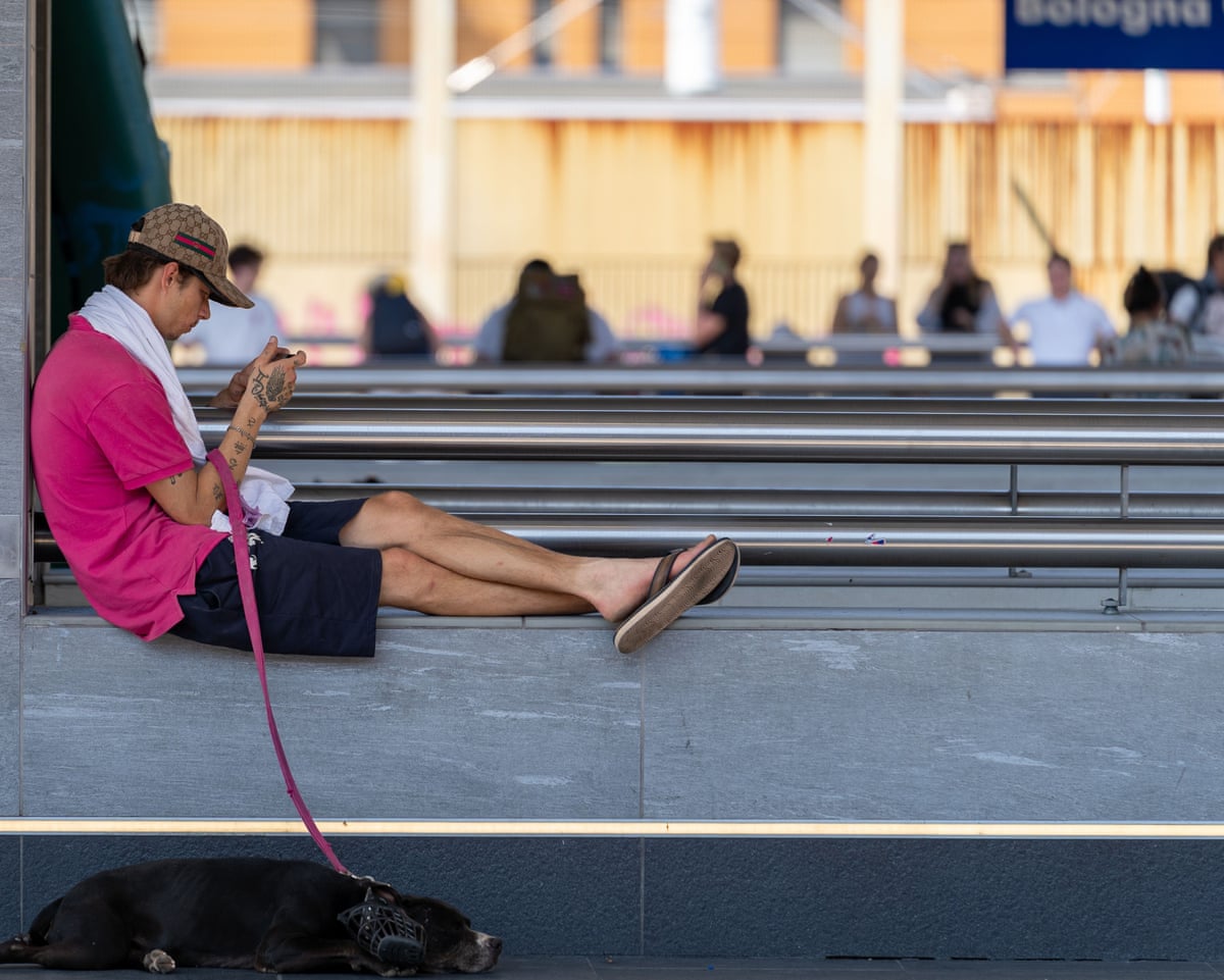 A person seeks relief from high temperatures during a heatwave in Bologna.