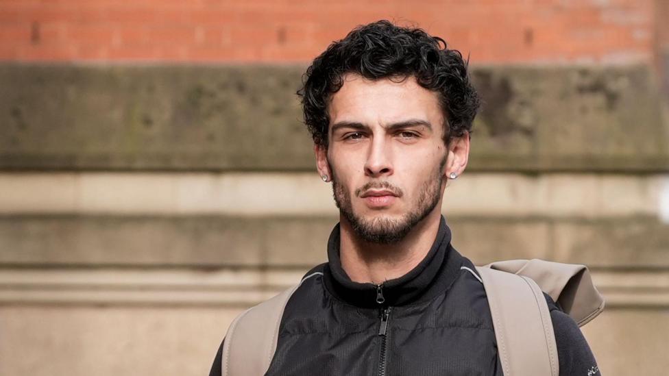Defendant Jordan Wallace arriving at Minshull Street Magistrates' Court, Manchester.
