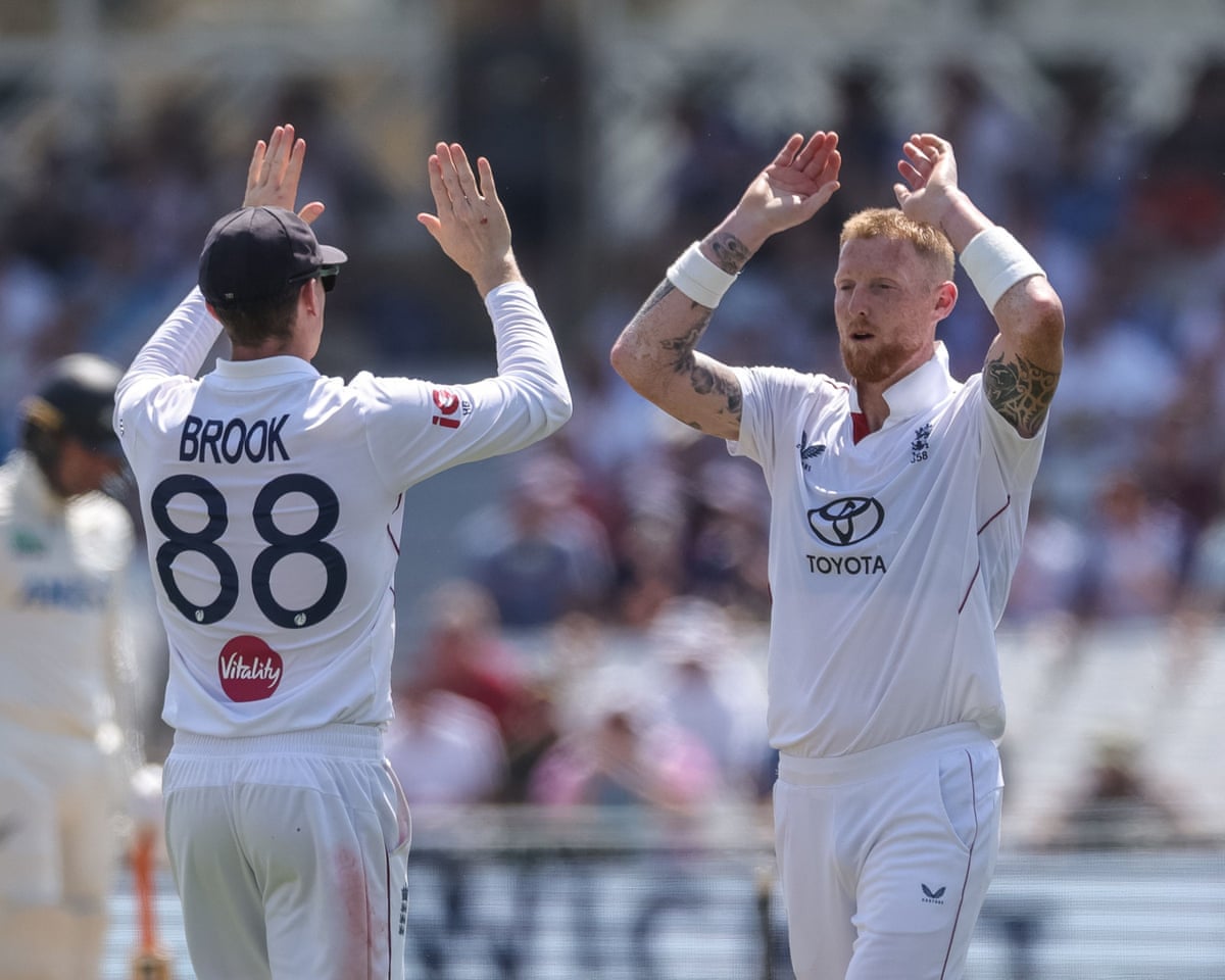 England cricketers Harry Brook and ben Stokes celebrate together after taking the wicket of New Zealand’s Will O’Rourke