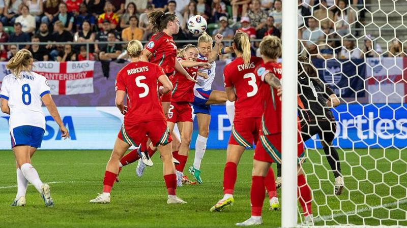 Lily Woodham of Wales (L) fights for heading the ball with Leah Williamson of England (R) during the UEFA Women's EURO 2025 Group D match between England and Wales at Arena St. Gallen on July 13, 2025 in St Gallen, Switzerland.