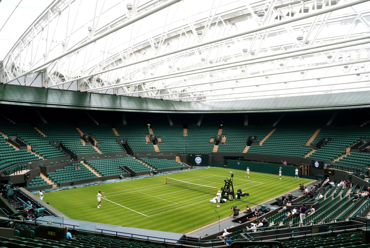 Novak Djokovic and world No 1 Jannik Sinner warm-up for Wimbledon under the roof of No 1 Court