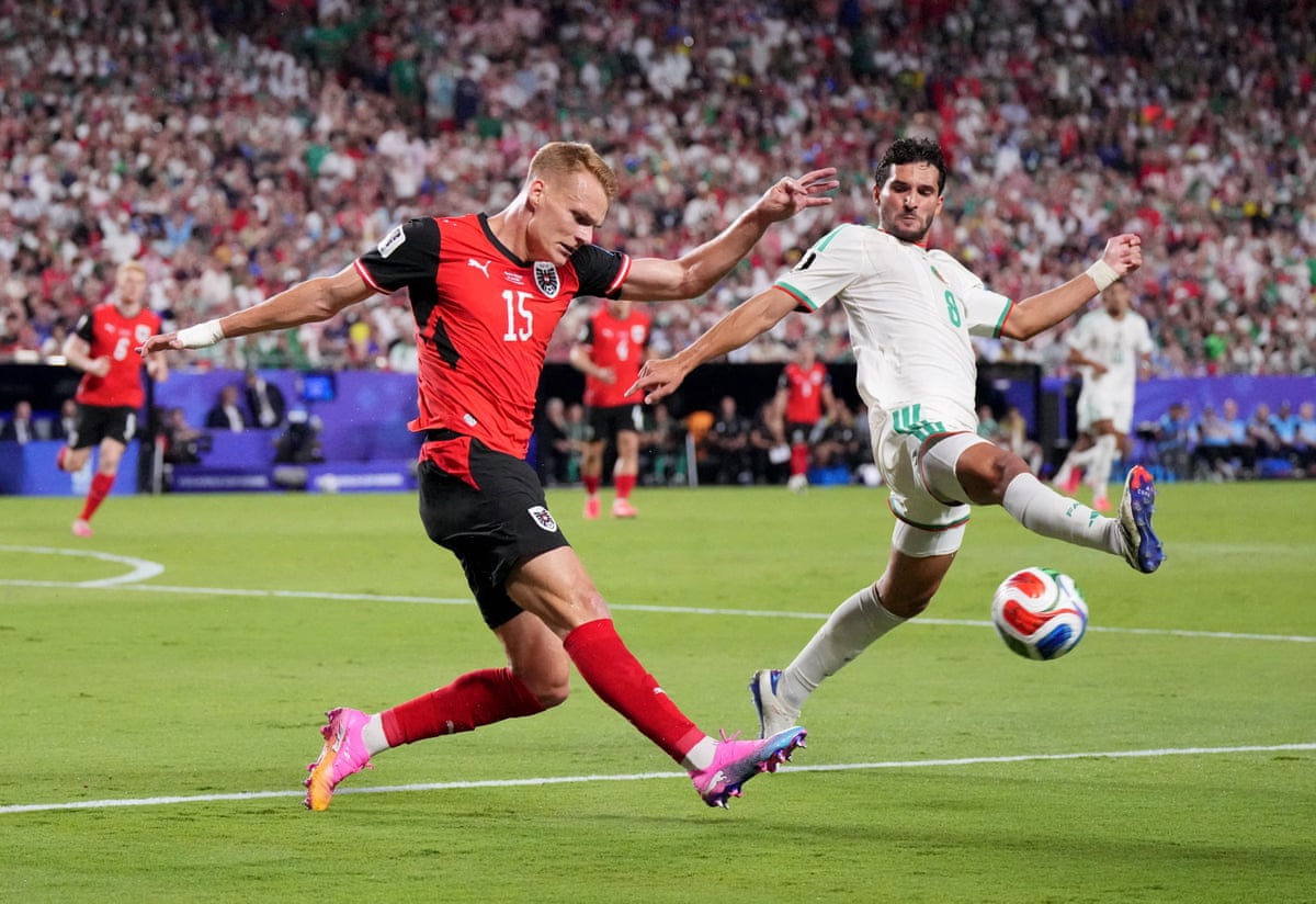 Philipp Lienhart’s cross is closed down by Algeria's Houssem Aouar.