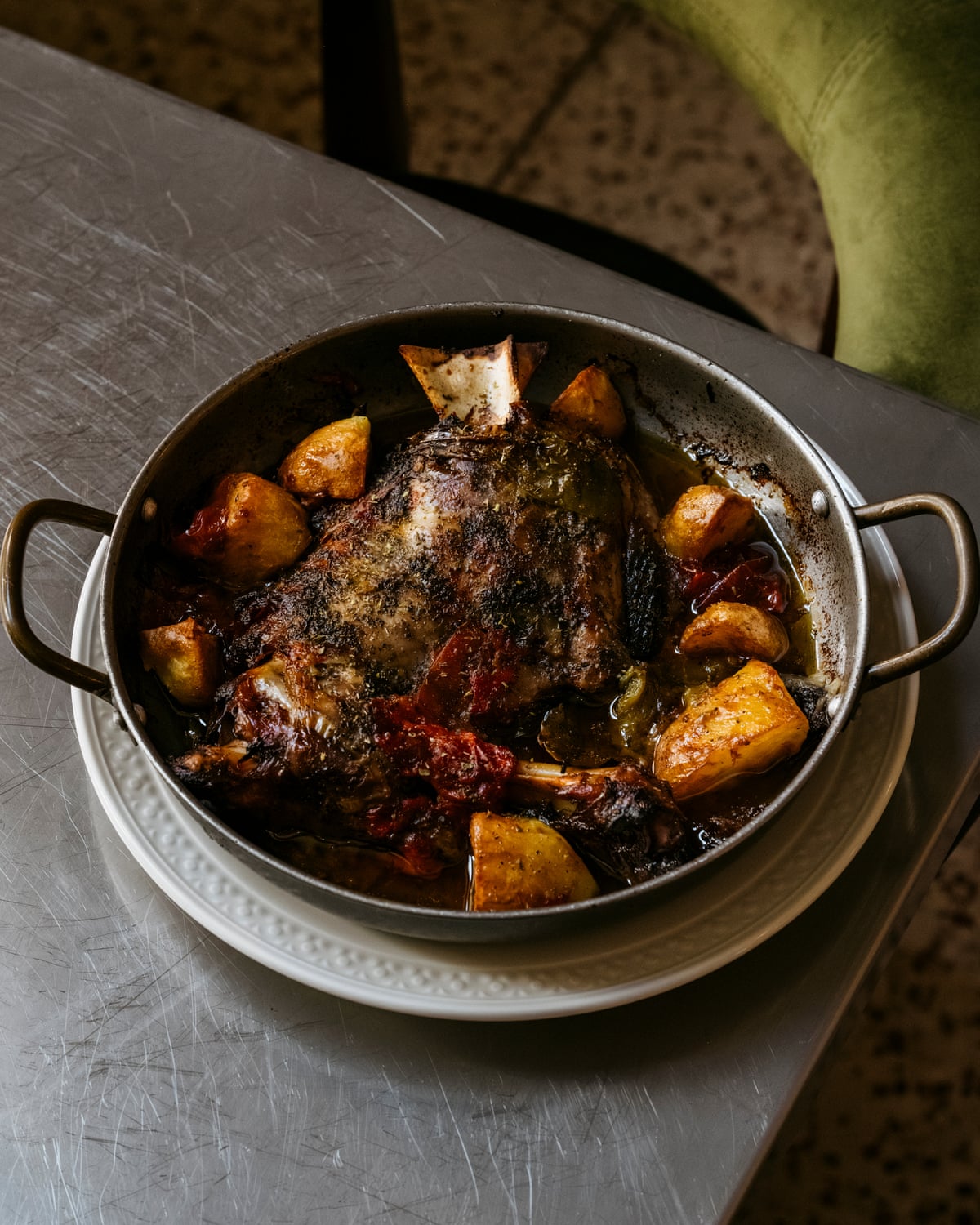 Serving dish full of lamb with potatoes