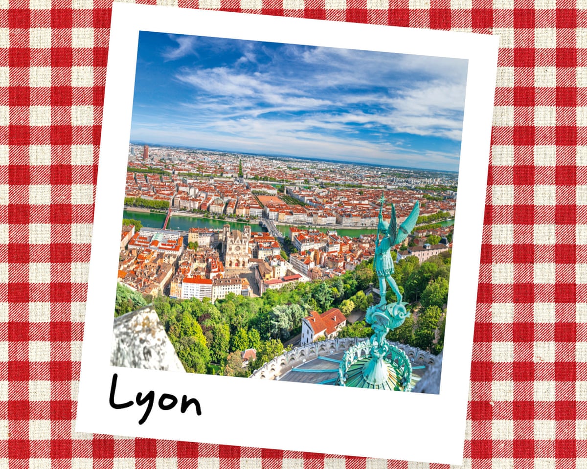 An instant photo of an aerial view of Lyon, with a statue in the foreground, against a red gingham background.