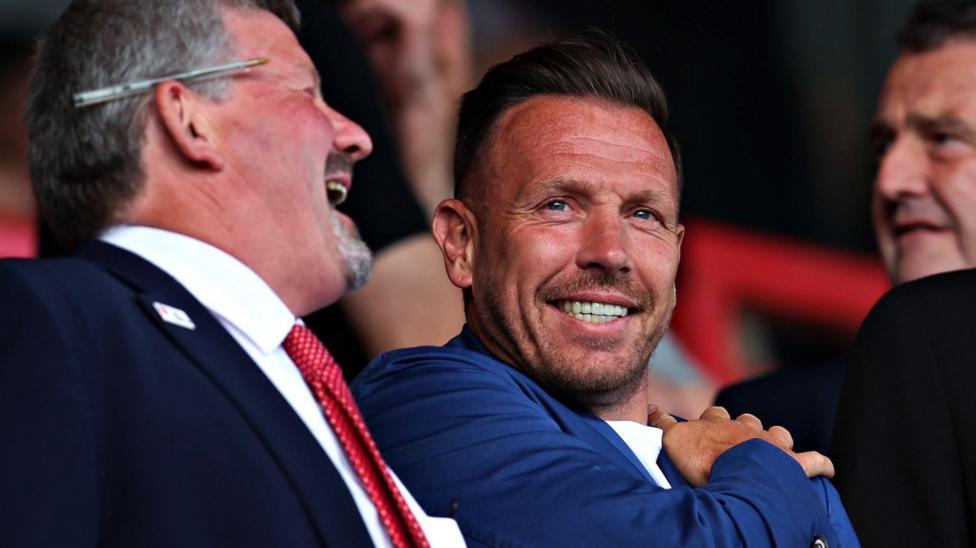 Craig Bellamy looks on from the stands at Wrexham