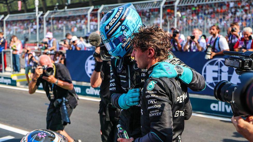 George Russell hugs Kimi Antonelli after the Austrian Grand Prix 
