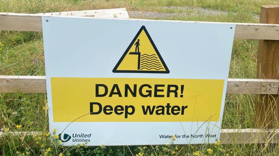 Sign reading: 'DANGER! Deep Water'.