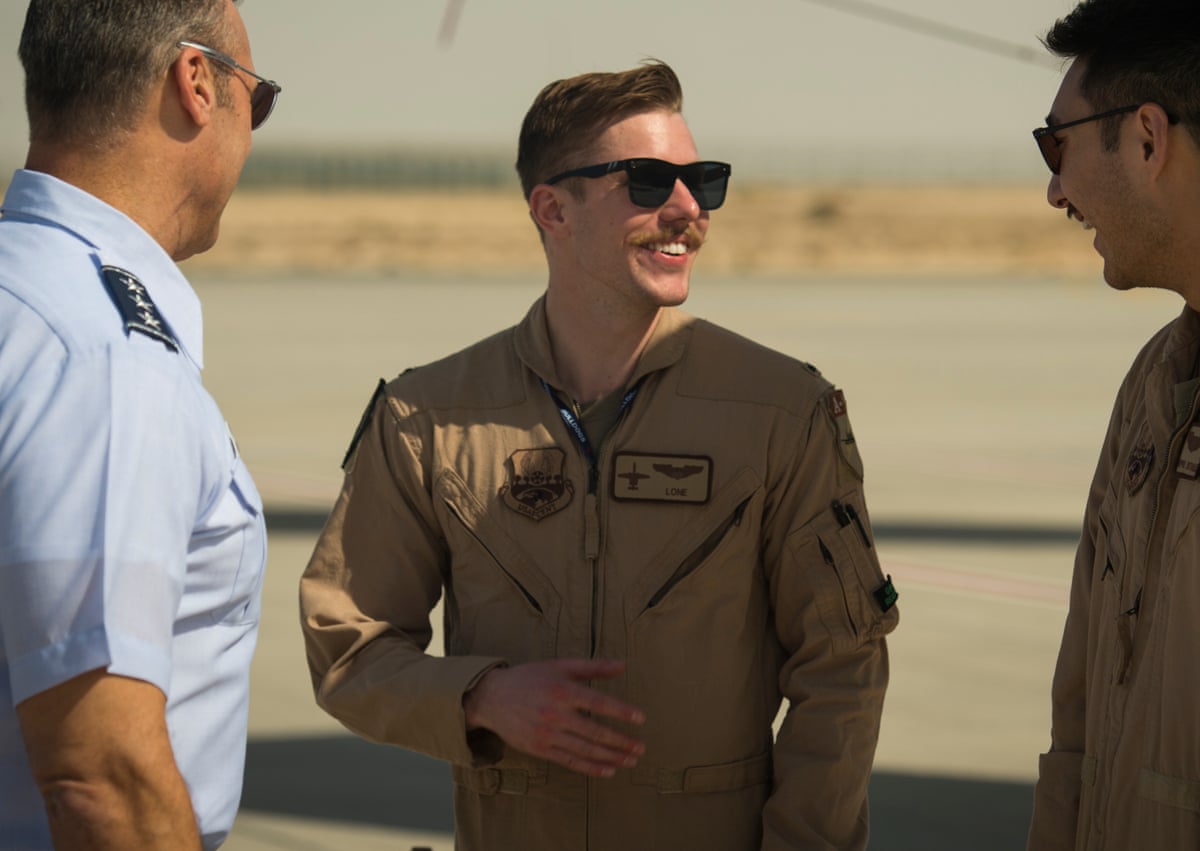 Wulfson (centre) with two colleagues at the Dubai airshow in UAE in 2019.