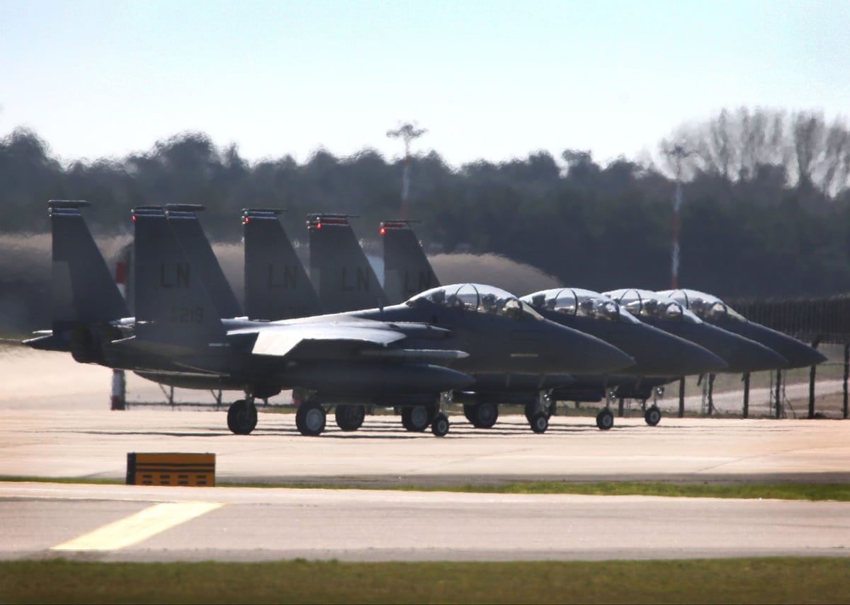 F-15’s lined up for takeoff on runway