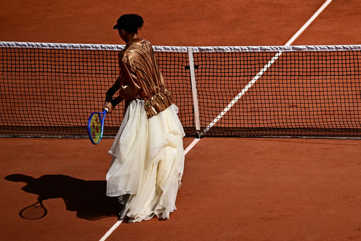 Naomi Osaka warms up in a corset and trailing skirt