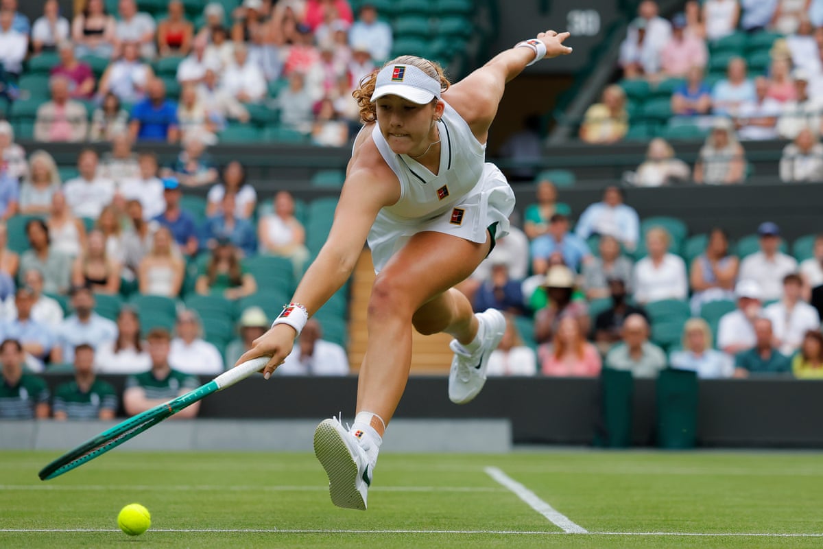 Mirra Andreeva lunges for the ball against Magda Linette