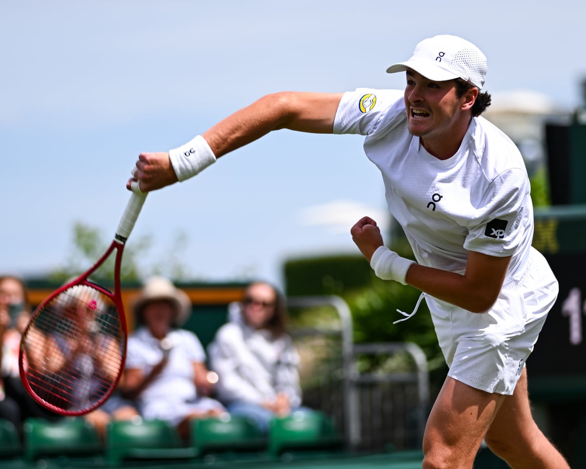 João Fonseca serves during his straight sets victory over Roberto Bautista Agut in the first round of Wimbledon 2026.