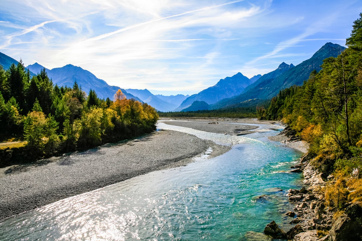 The River Lech near Forchach, Austria, with the Lechtal Alps in the distance