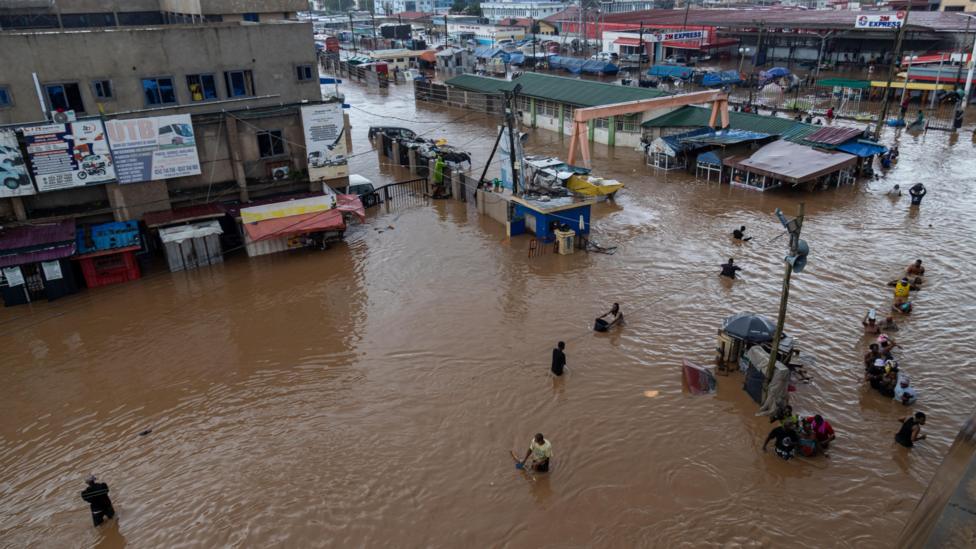 View from above of people walking through the floodwater
