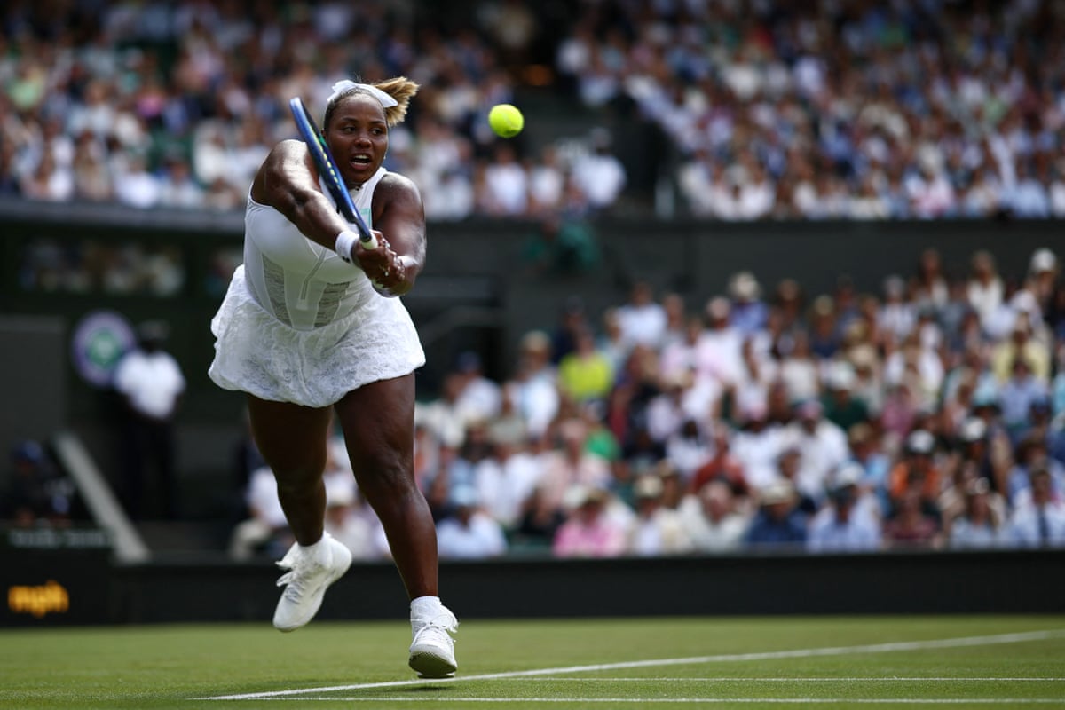 Taylor Townsend returns the ball against Iga Swiatek during their women's singles first round match at Wimbledon 2026.