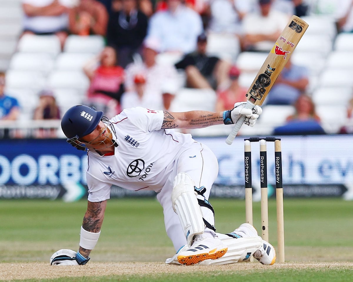 The England captain Ben Stokes ends up on his knees and with one hand off the bat after playing a reverse sweep.