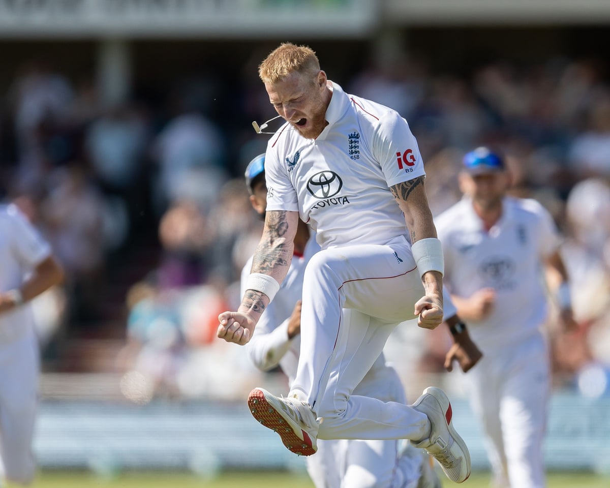 The England captain Ben Stokes leaps in the air to celebrate taking a wicket.