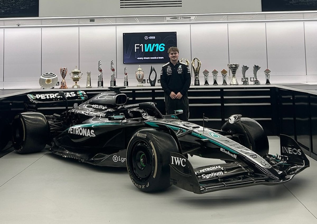 Kian Brown stands next to a Mercedes F1 car at Silverstone UTC