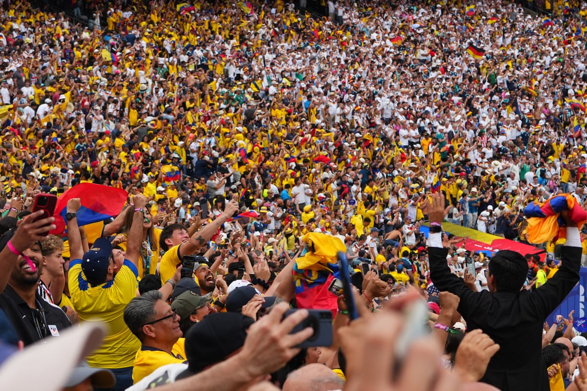 people cheering in a stadium