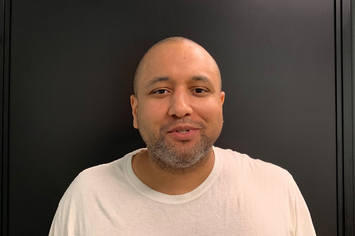 a man wears a white t-shirt