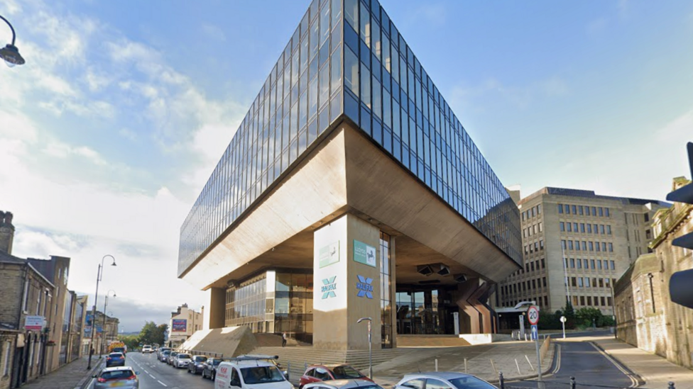 The Halifax headquarters: a large square stone and glass building