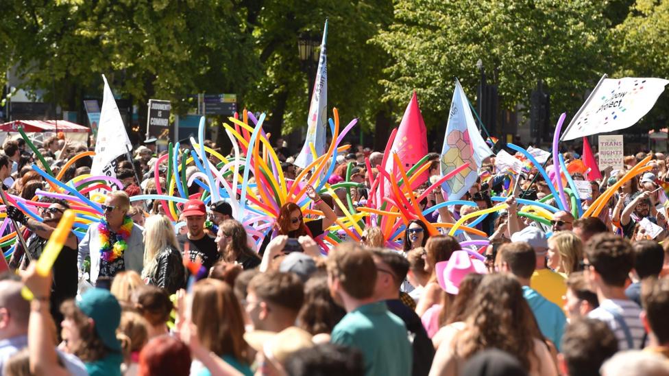 People taking part in the Belfast Pride Parade 2023.