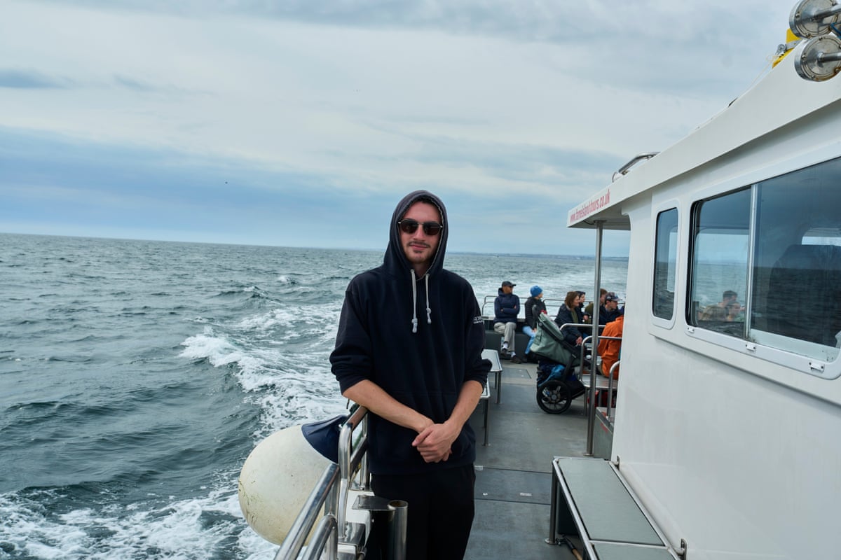 Crewman Aaron Fordy on a Serenity Farne Island Tours boat