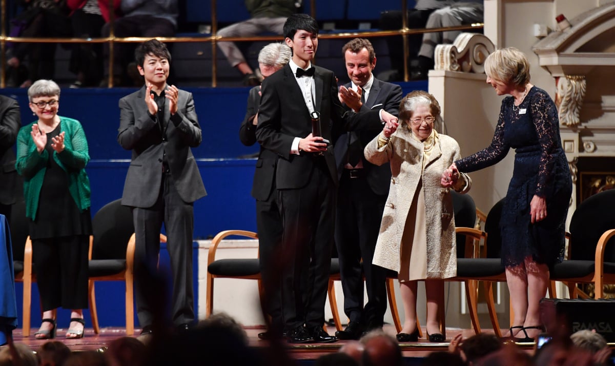 A group of people standing on a stage