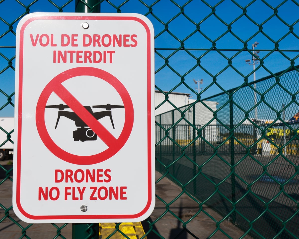 A sign reads 'Drones no fly zone' outside Liege Airport terminal, Belgium.