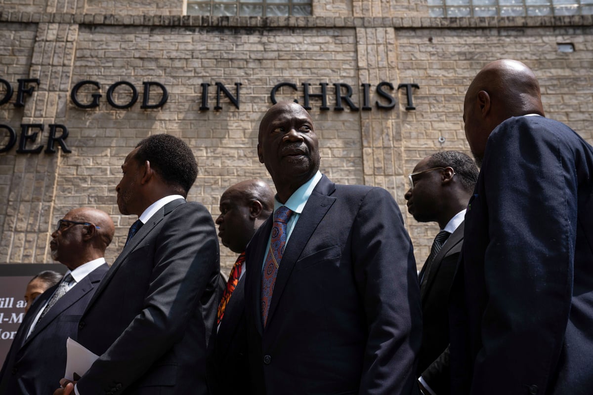 a group of men standing outside a nation...</div></div><div class=
