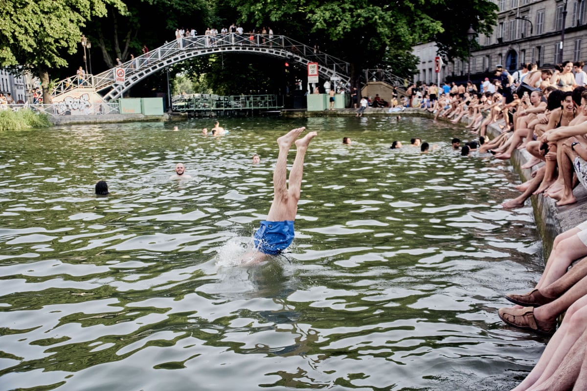 A person dives into water.