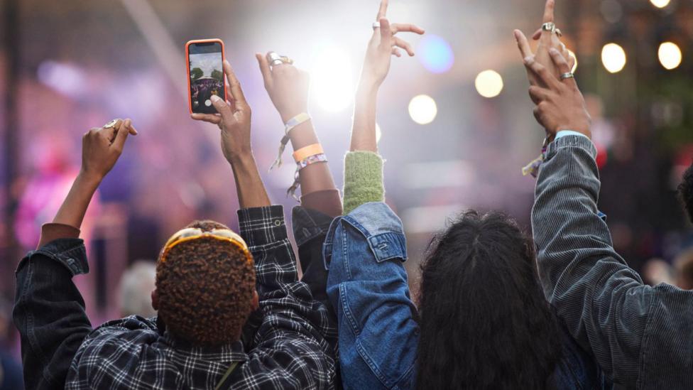 People pictured enjoying themselves at a festival