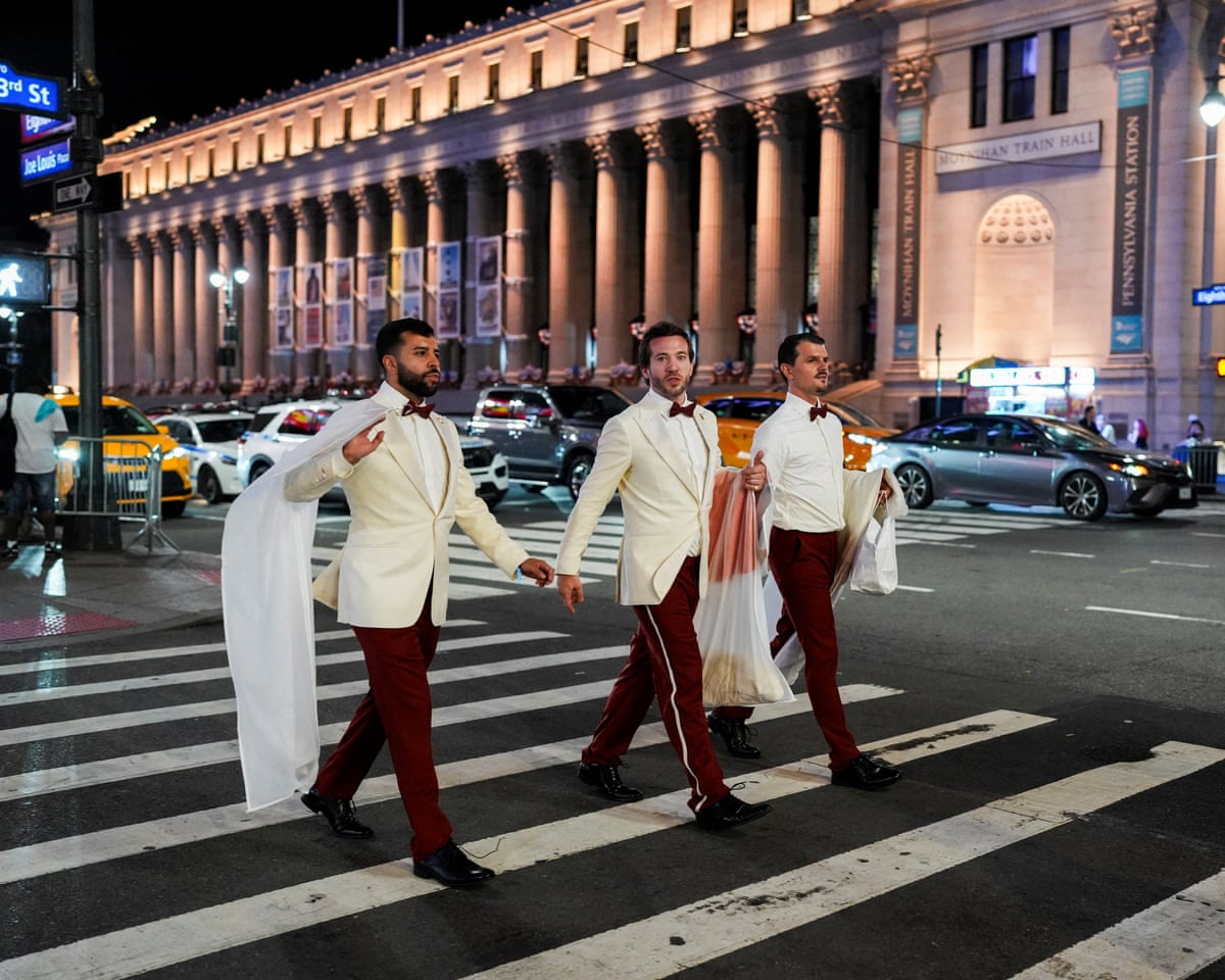 Workers believed to be a part of the wedding between Swift and Kelce cross a road outside Madison Square Garden