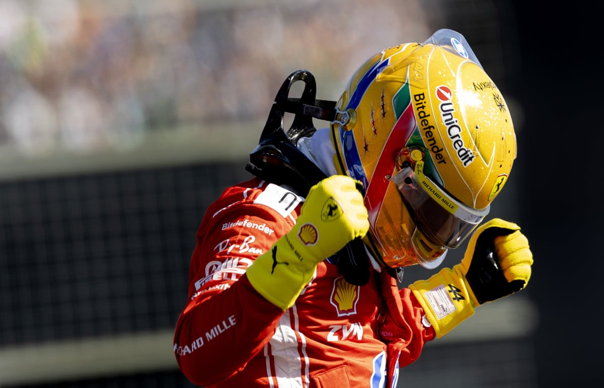 Lewis Hamilton clenches his fists in delight