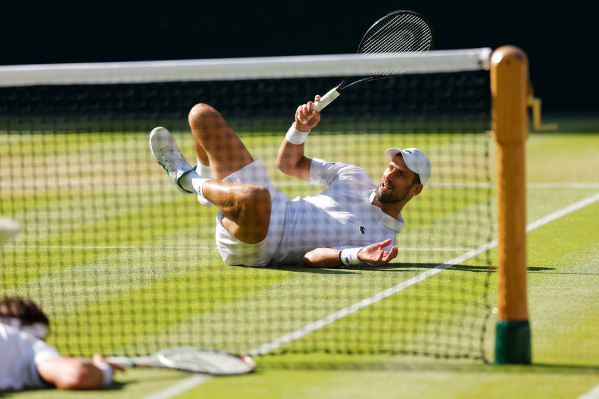 Novak Djokovic and Arthur Rinderknech after falling on the grass 
