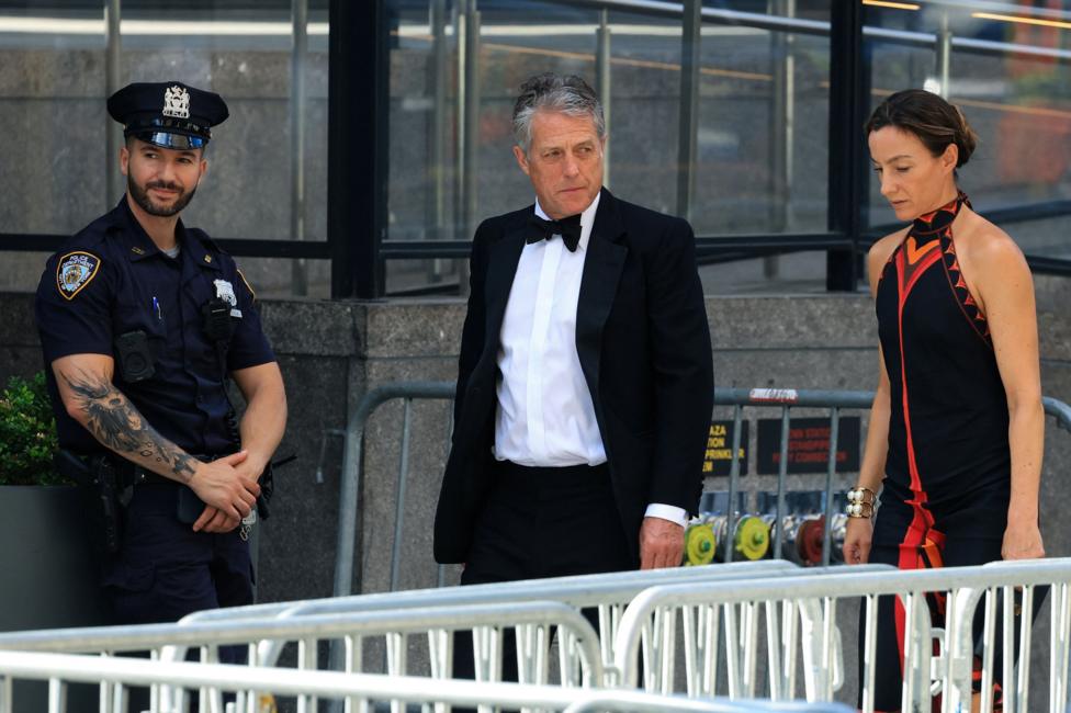 Actor Hugh Grant and wife Anna Elisabet Eberstein arrive at Madison Square Garden in formalwear.