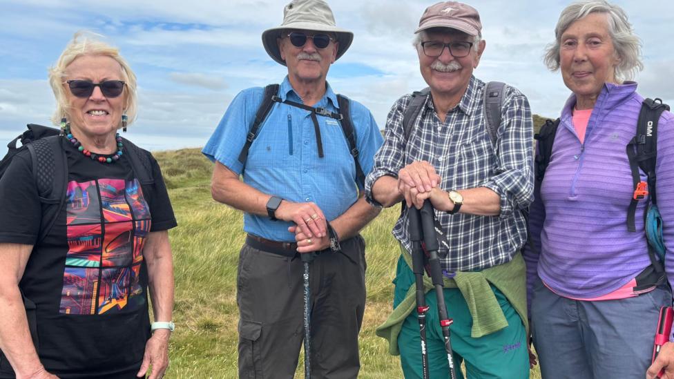 Ramblers Nancy and John Thirsk and Colin and Anne Darlington smiling at the camera on the Denbigh moors
