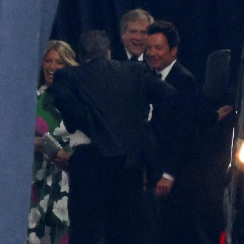 US TV presenter Jimmy Fallon arrives at Madison Square Garden behind a dark curtain.