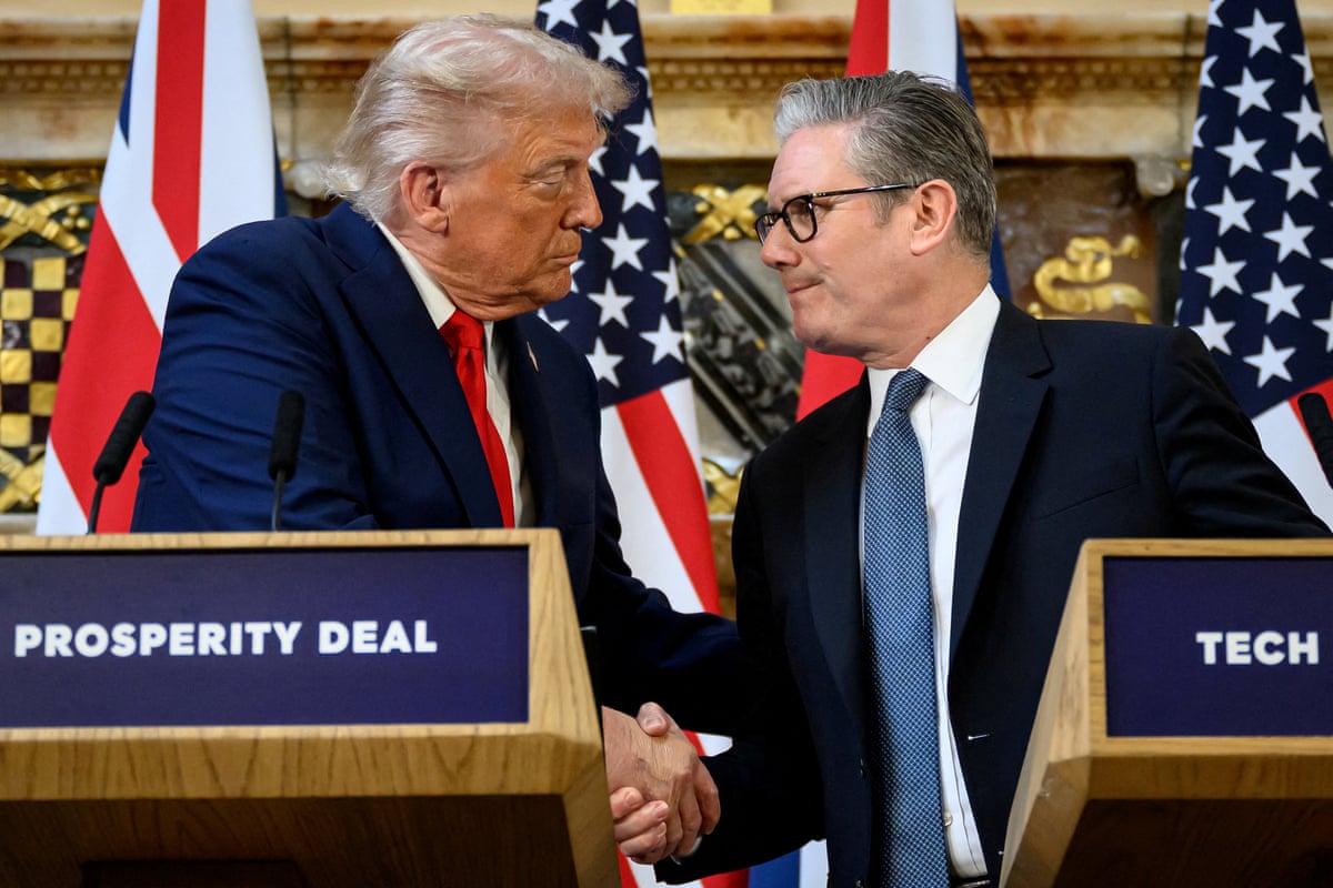 Trump and Starmer shake hands, as they stand at lecterns that say ‘tech prosperity deal’ on the front