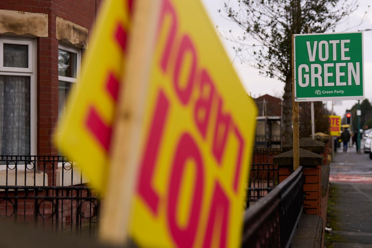 Vote Labour and Vote Green signs on a street in Greater Manchester
