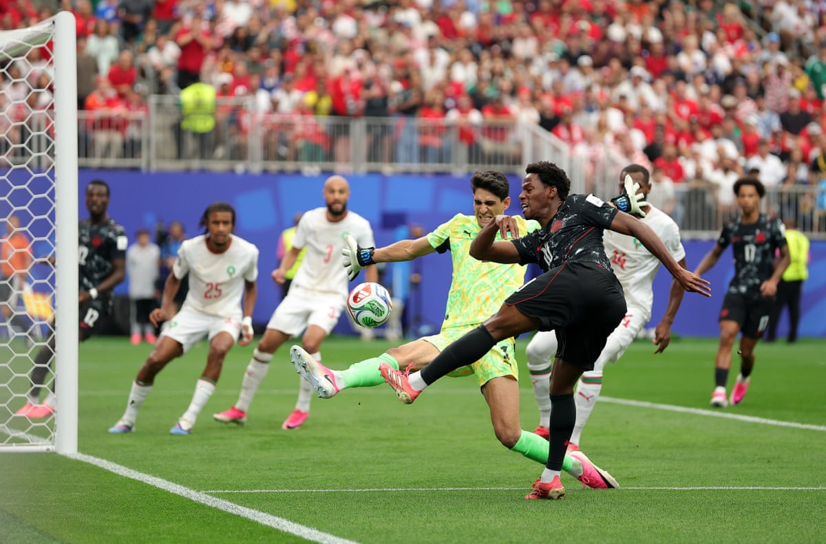 Canada’s Jonathan David shoots against goalkeeper Yassine Bounou