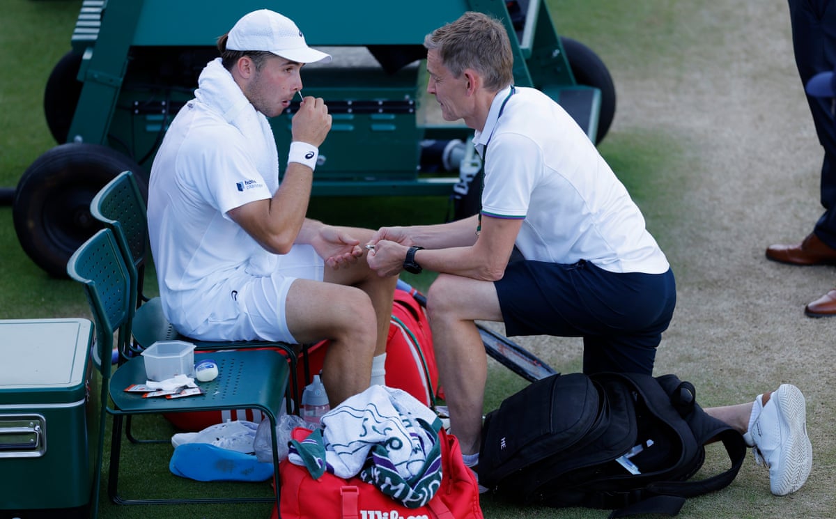 Arthur Fery has treatment for a nosebleed at Wimbledon.