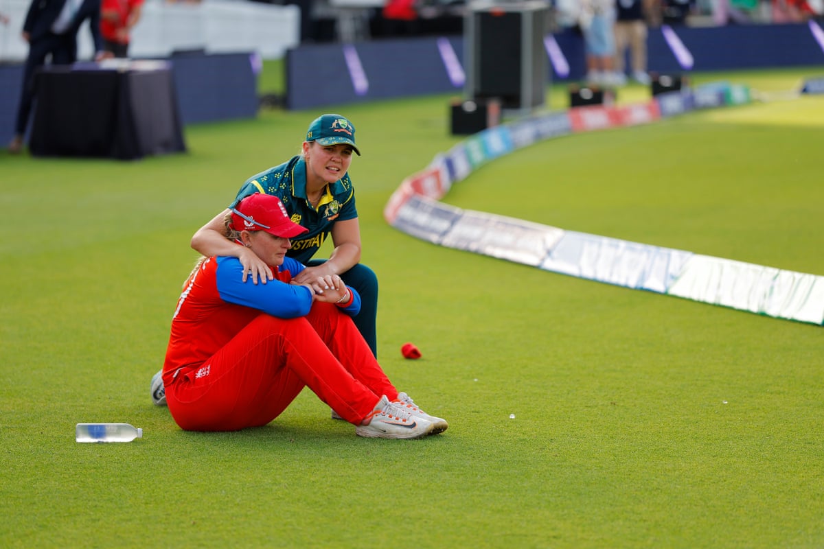 Sophie Ecclestone is consoled by Georgia Voll after England’s defeat.