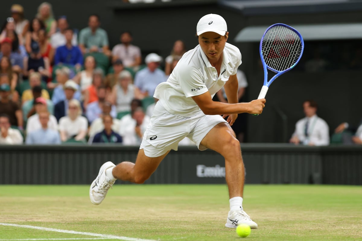 Shintaro Mochizuki stretches to play a shot