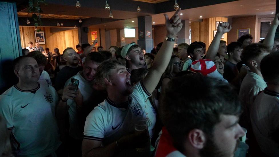 A large group of England football fans gathered in The Hyde Dendy pub in Paignton to watch the game against Mexico. 