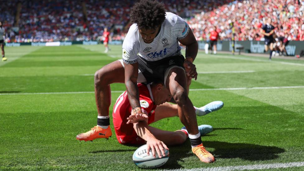 Wales wing Josh Adams scored the bonus-point try against Fiji