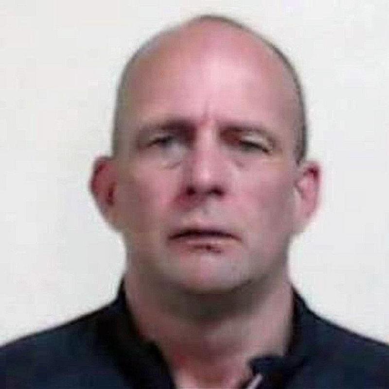 A head shot of David Brown, a man with a shaven head looking directly into the camera.